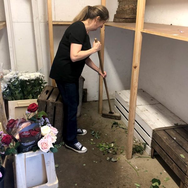 Florist ceaning out the store room